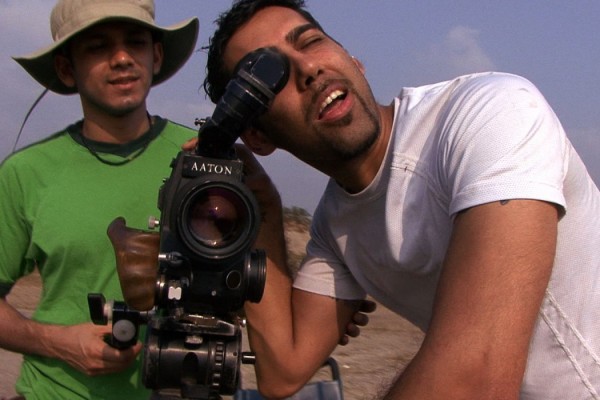 DaSilva behind an Aaton film camera on location.